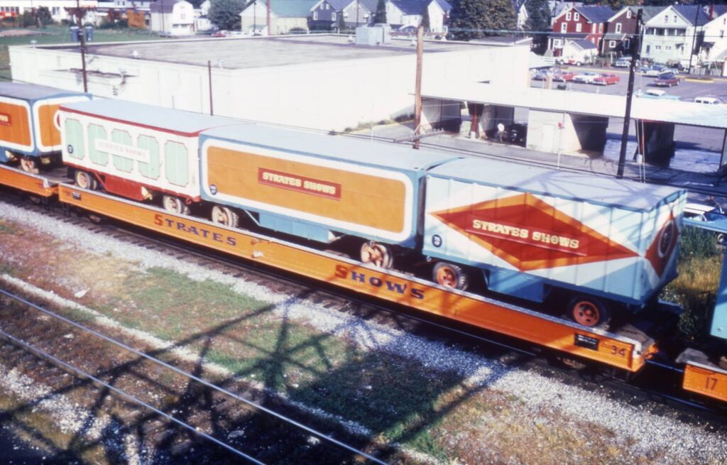 alt=Railroad Trains loaded with colorful wagons