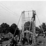 Con T. Kennedy Shows sets the wheel...early 1900's.jpg