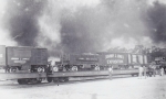 J J J flats stand idle with a wild fire burning close in the background 1930's.jpg