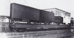 The Jones flats wait patiently on a siding for a 'fast mail' to pass... 1930's early 1940's.jpg