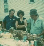 L.D. Wheeler and his wife Linda with Leo Johns carving up a lamb on the Wheeler Shows in Kentucky 1970's. That's my 40 foot semi living quarters behind them. I still have it..jpg