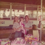Linda Rivera, daughter Marie and brother Billy celebrate Maries birthday at Ric'Nakatani's new Cookhouse on the West Coast ShowsMidway at Bakersfield Cal ..1970's.jpg