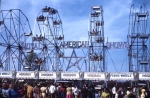 Four number. 5 Eli Ferris Wheels stretch across the Royal American Shows front gate. 1960's.