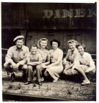 A family by the Hennis Bro's Carnival 'pie car' 1930's.jpg