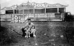 Photo of Joe Silcox with a wagon. In the wagon on the left is Meachel Arnett and Joann Silcox is on the right. Photo was taken in 1947..jpg