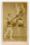 Alonzo Hiwanda holds two men & a barrel with his mouth 1865.jpg